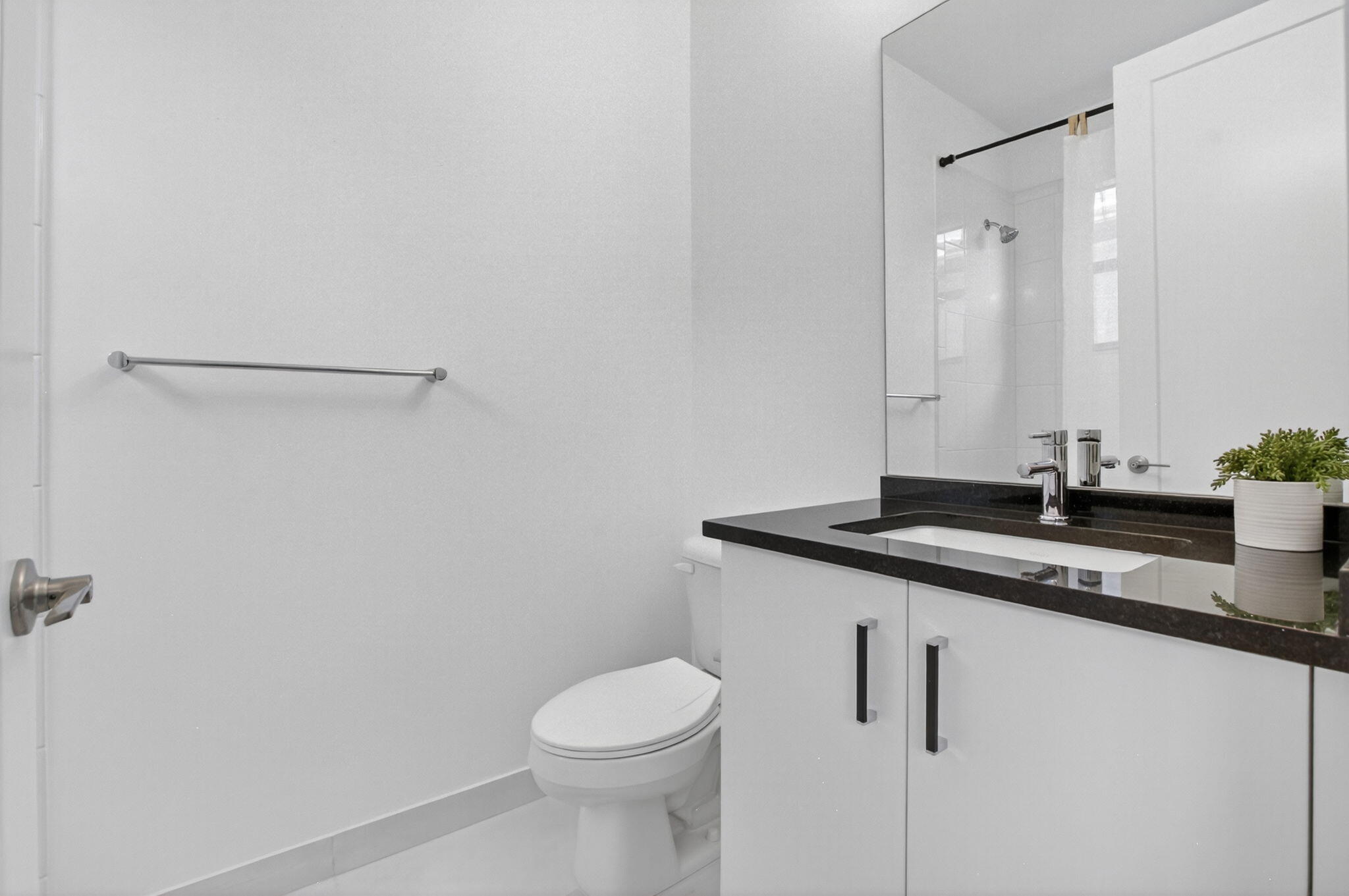 20278 Bandon Dunes Road Boca Raton, FL 33434 - Photo 50 of 113 a bathroom with a granite countertop sink a toilet and a mirror