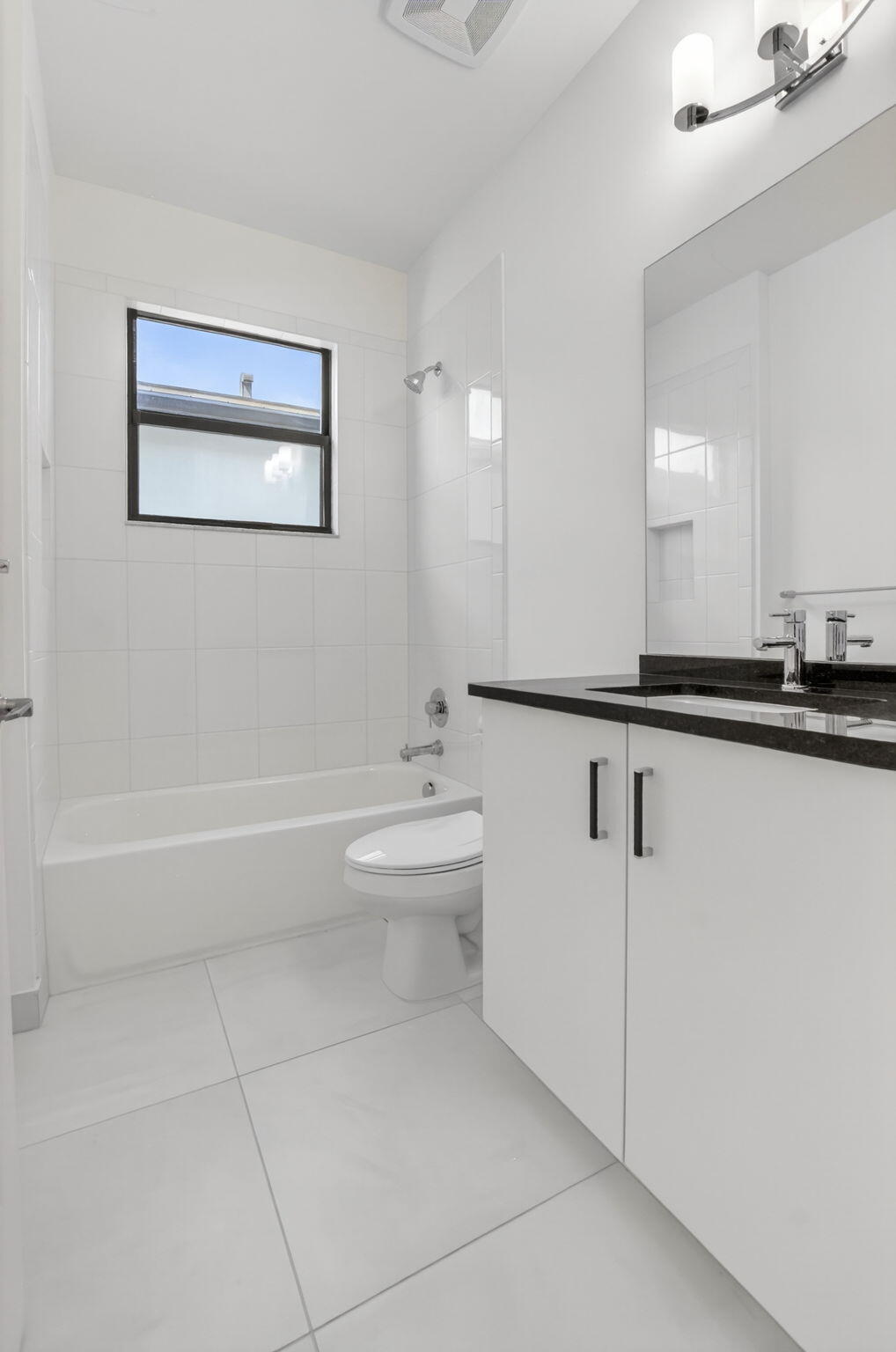 20278 Bandon Dunes Road Boca Raton, FL 33434 - Photo 56 of 113 a bathroom with a toilet a sink and mirror