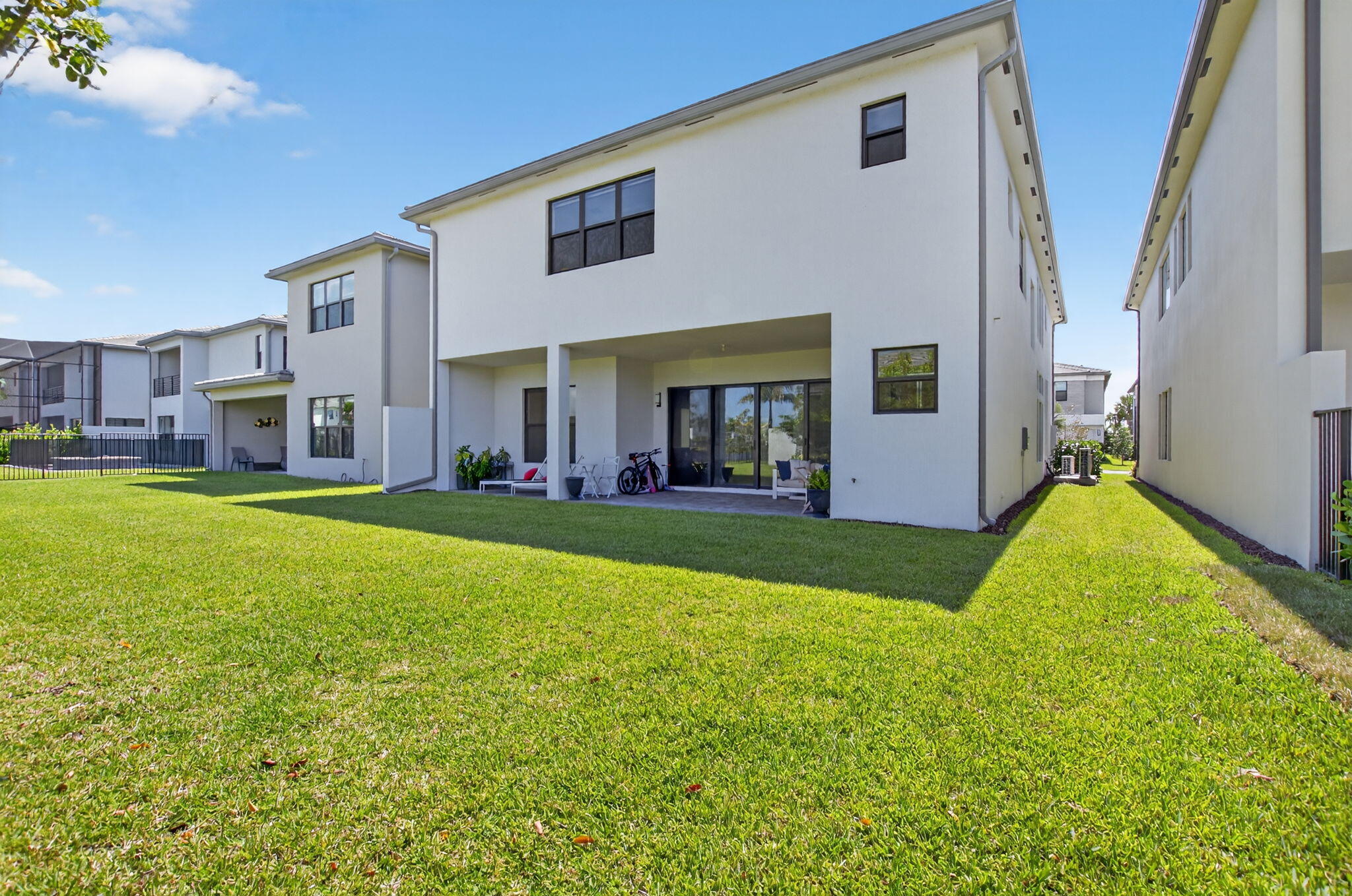 20278 Bandon Dunes Road Boca Raton, FL 33434 - Photo 66 of 113 a view of a house with a big yard and potted plants