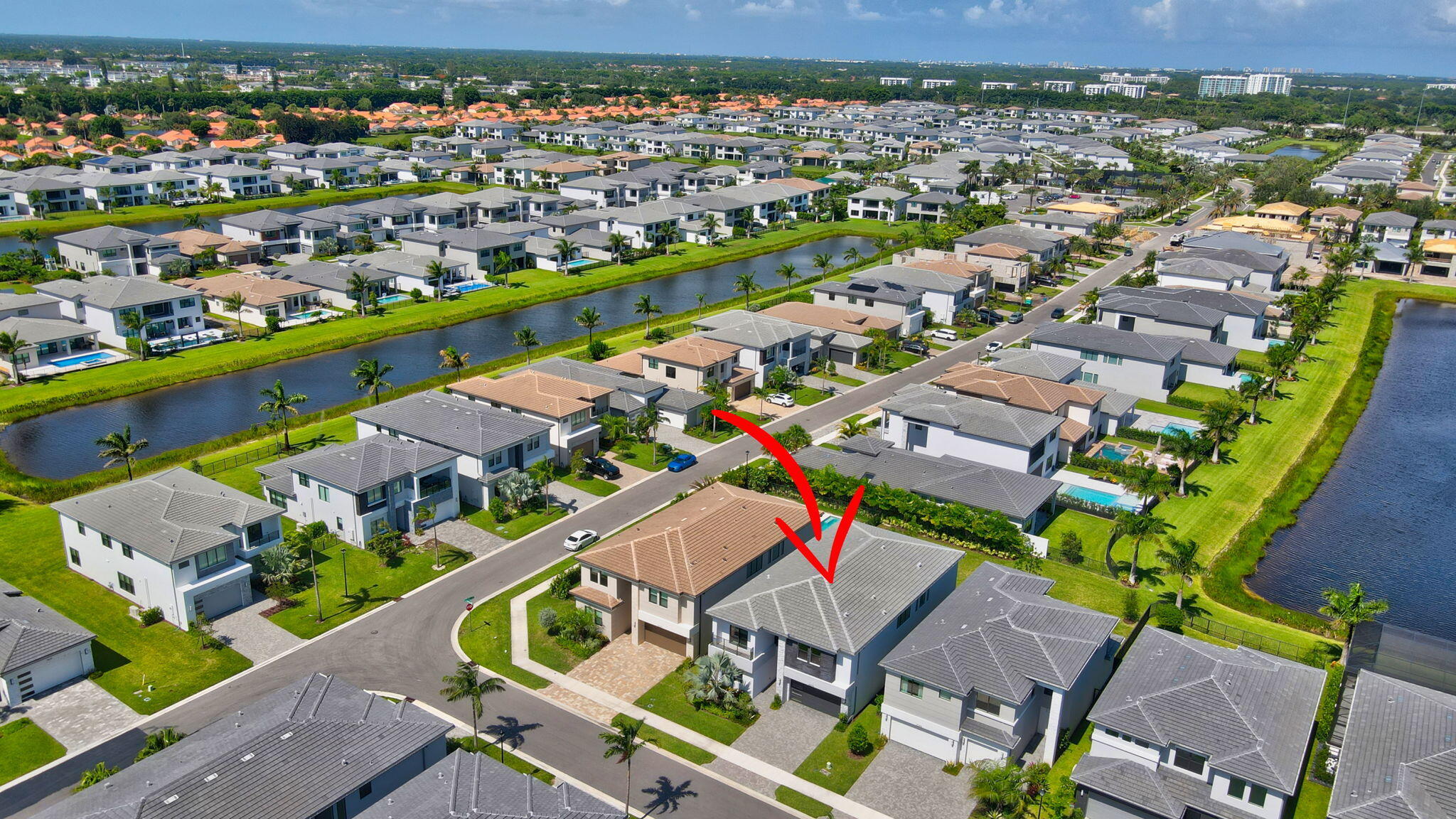 20278 Bandon Dunes Road Boca Raton, FL 33434 - Photo 76 of 113 an aerial view of a city with lots of residential buildings ocean and mountain view in back
