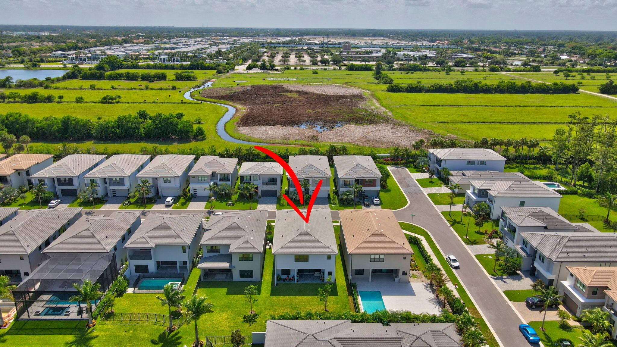 20278 Bandon Dunes Road Boca Raton, FL 33434 - Photo 79 of 113 an aerial view of a house with a garden and lake view