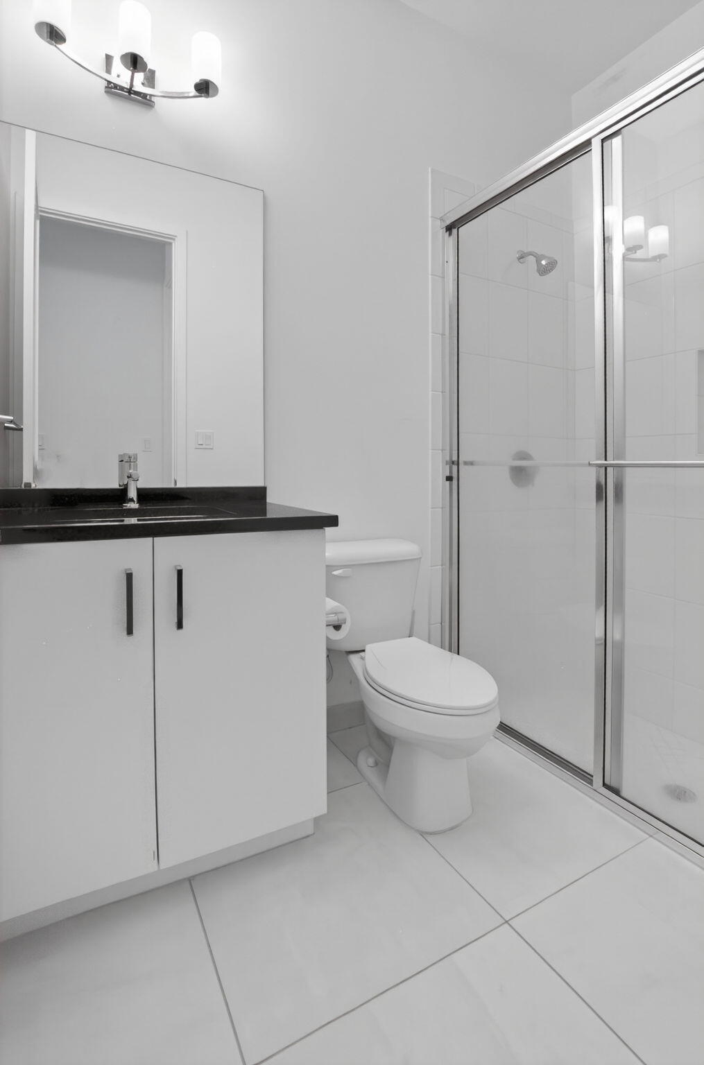 20278 Bandon Dunes Road Boca Raton, FL 33434 - Photo 10 of 113 a bathroom with a granite countertop toilet a sink and a mirror