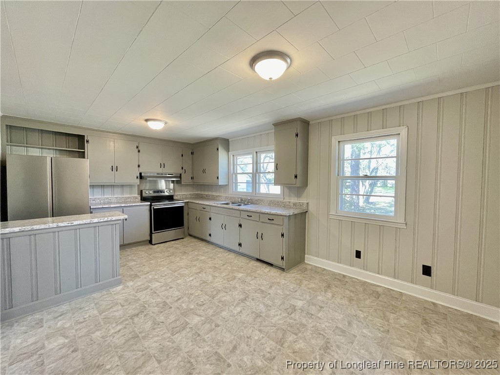 531 East Donaldson Avenue Raeford, NC 28376 - Photo 2 of 16 a kitchen with granite countertop a sink and cabinets