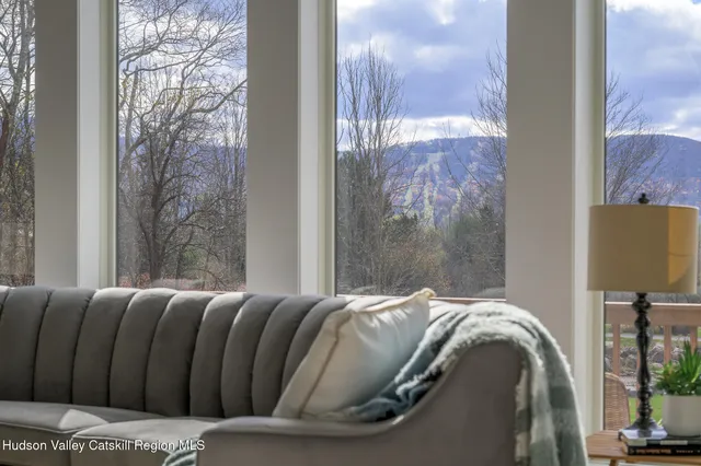 a kitchen with stainless steel appliances a white cabinets stove and wooden floor