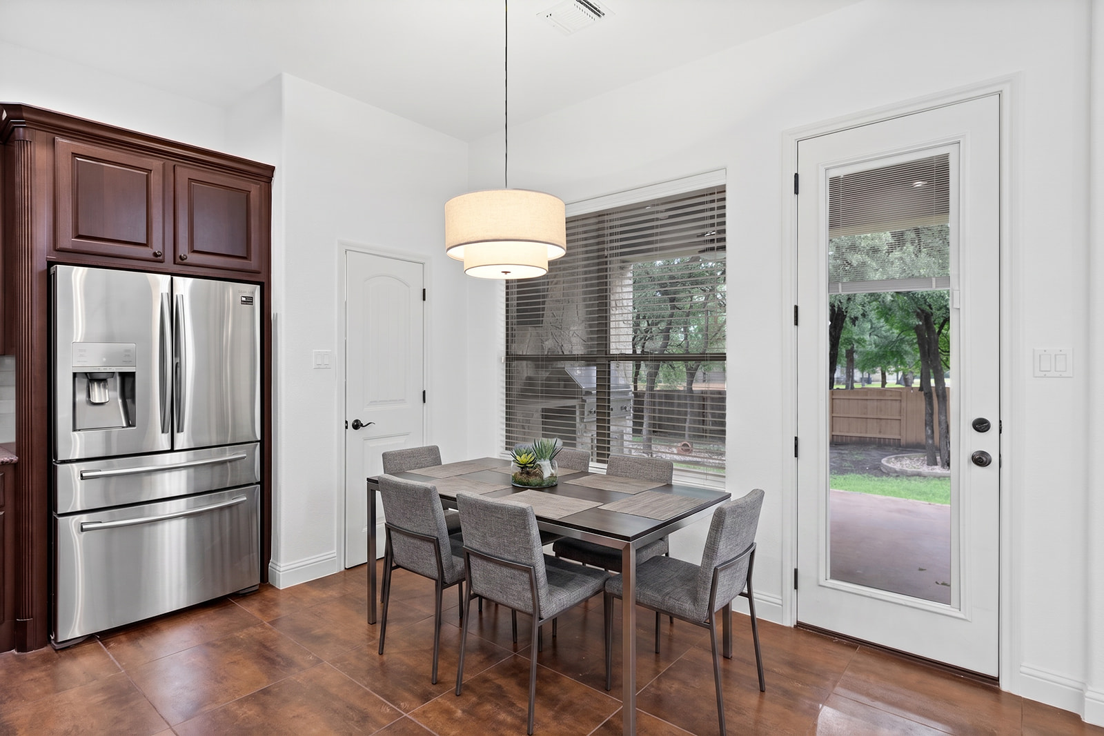 114 North Saddle Ridge Drive Cedar Park, TX 78613 - Photo 15 of 40 a view of a dining room with furniture window and wooden floor