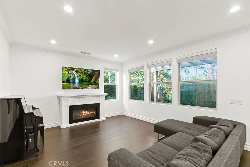 120 Gemstone Irvine, CA 92620 - Photo 11 of 43 a living room with furniture window and a fireplace