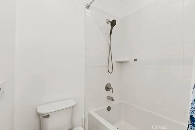 a bathroom with a bath tub and a shower