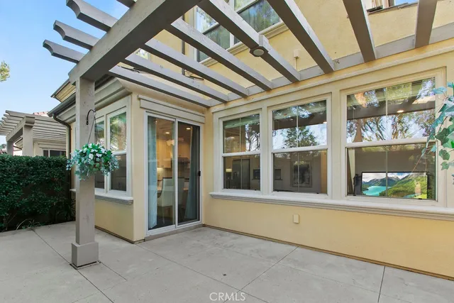 an aerial view of multiple houses with a yard