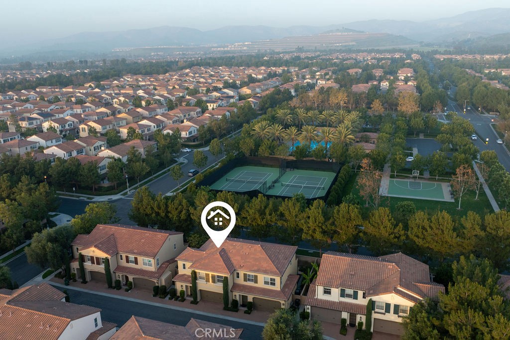 120 Gemstone Irvine, CA 92620 - Photo 34 of 43 an aerial view of a house with yard and mountain view in back