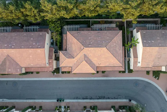 an aerial view of residential houses with street