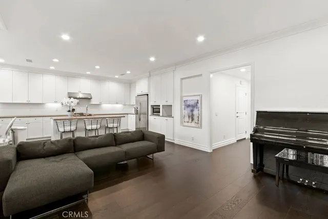 a living room with furniture and a piano