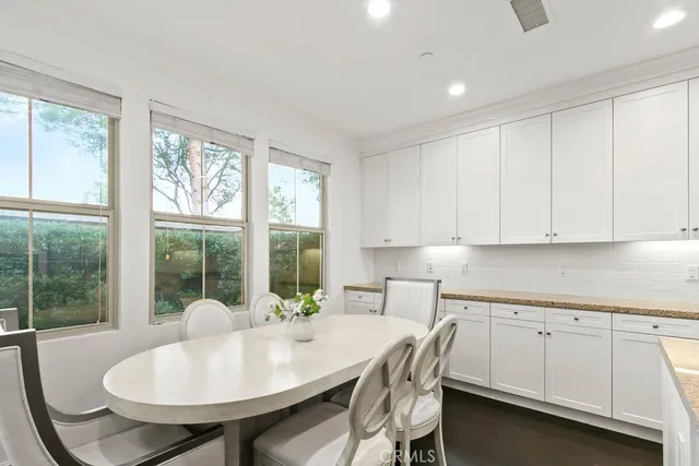a open dining room with furniture and window