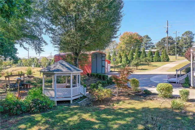 a kitchen with a sink cabinets and wooden floor