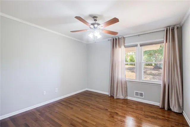 a bathroom with a granite countertop sink mirror and bathtub