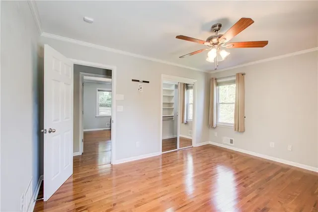 a view of a patio with a table and chairs under an umbrella