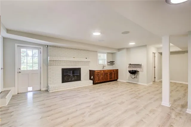 aerial view of a house with yard and deck