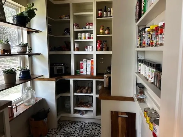 a room with furniture and a book shelf