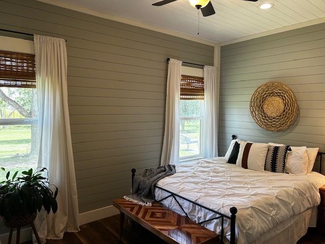 365 Mercers Preserve Road Comanche, TX 76442 - Photo 15 of 27 a bedroom with a bed and a chandelier