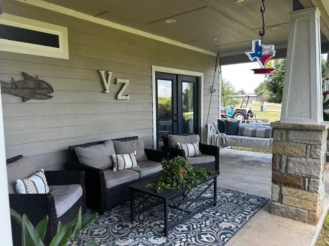 365 Mercers Preserve Road Comanche, TX 76442 - Photo 22 of 27 a living room with furniture and a large window