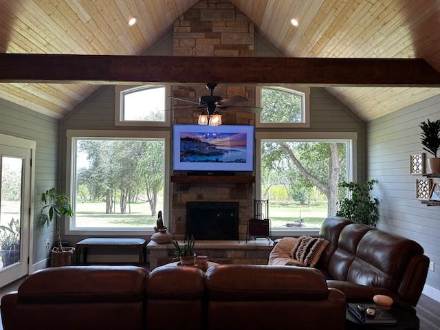 365 Mercers Preserve Road Comanche, TX 76442 - Photo 6 of 27 a living room with furniture a floor to ceiling window and a flat screen tv