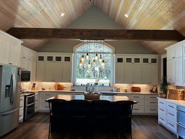 365 Mercers Preserve Road Comanche, TX 76442 - Photo 9 of 27 a kitchen with a counter space dining table and stainless steel appliances