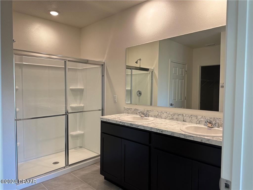 139 Empire Terrace Sebastian, FL 32958 - Photo 23 of 31 a bathroom with a sink and a mirror