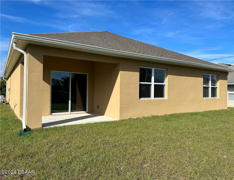 139 Empire Terrace Sebastian, FL 32958 - Photo 29 of 31 a front view of a house with a yard