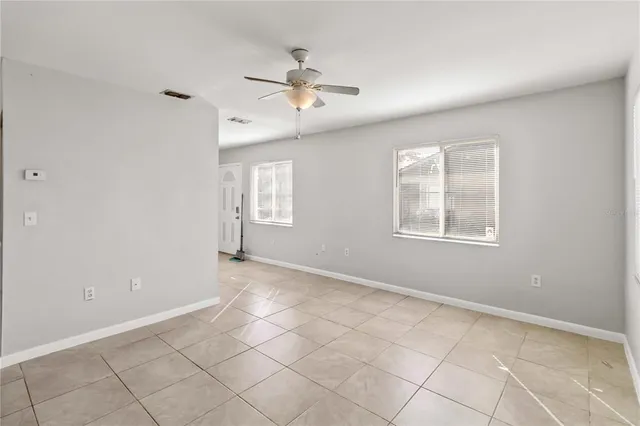 a view of an empty room with windows