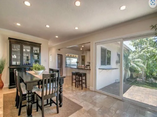 5512 Candlelight Drive La Jolla, CA 92037 - Photo 11 of 23 a view of a dining room with furniture and window