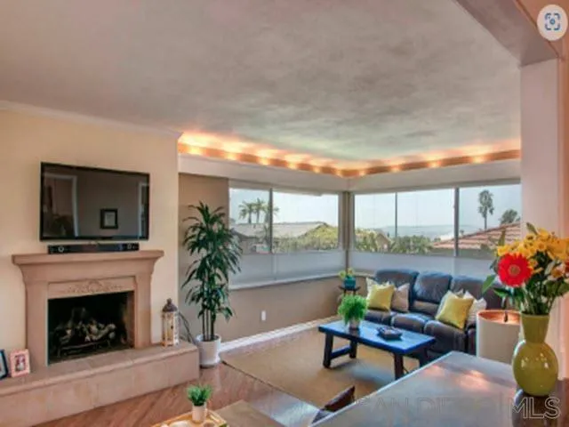5512 Candlelight Drive La Jolla, CA 92037 - Photo 14 of 23 a living room with furniture and a fireplace