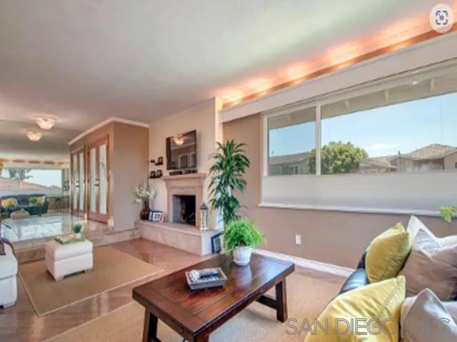 5512 Candlelight Drive La Jolla, CA 92037 - Photo 15 of 23 a living room with furniture and a potted plant