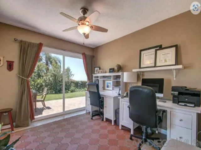 5512 Candlelight Drive La Jolla, CA 92037 - Photo 19 of 23 a view of a workspace with furniture and a window