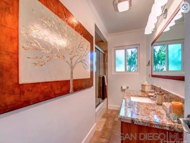 5512 Candlelight Drive La Jolla, CA 92037 - Photo 22 of 23 a view of a living room and kitchen with furniture