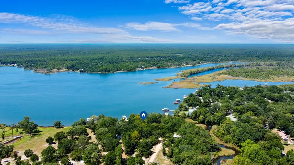 a view of a lake with a big yard