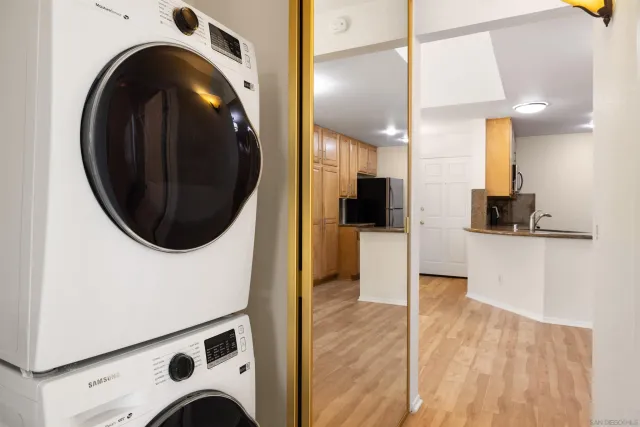 a view of a kitchen with a washer and dryer