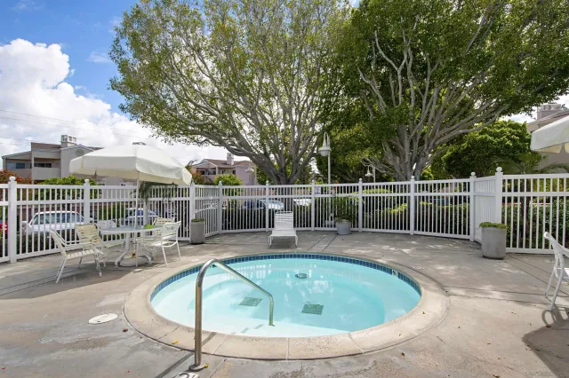 a view of a swimming pool with a patio