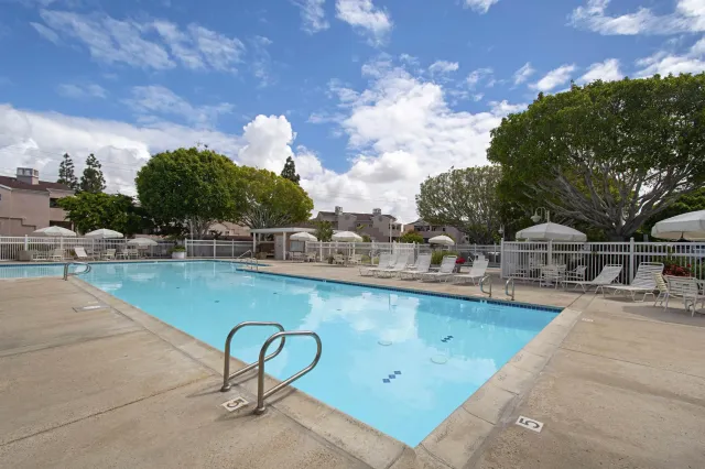 a view of a swimming pool with a lounge chair