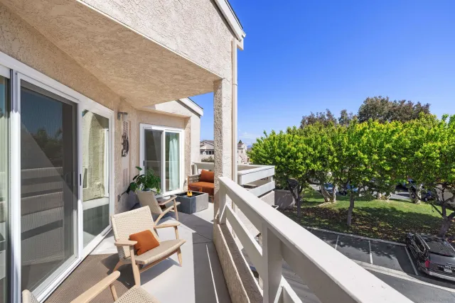 a view of a patio with table and chairs and potted plants