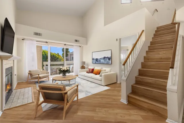 a living room with furniture fireplace and a flat screen tv