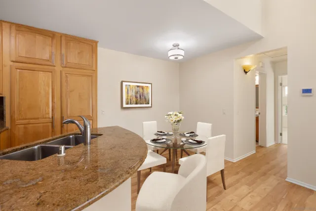 a dining room with table chairs and chandelier