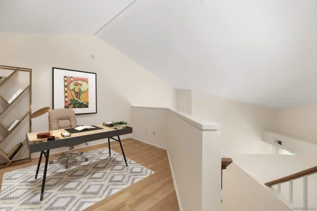 a workspace with furniture and window