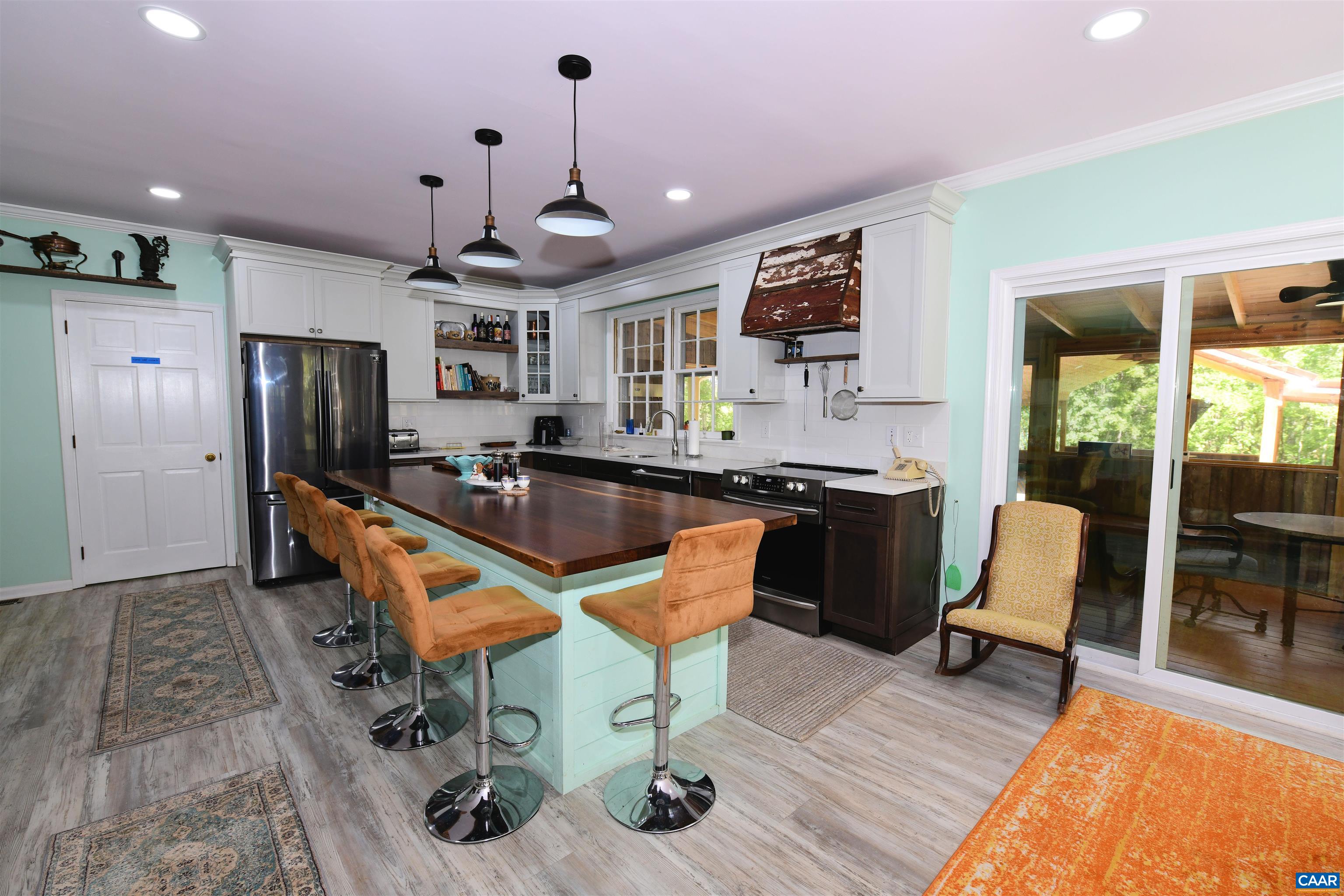 879 Evans Mill Road Dillwyn, VA 23936 - Photo 14 of 43 a kitchen with granite countertop a sink and a refrigerator