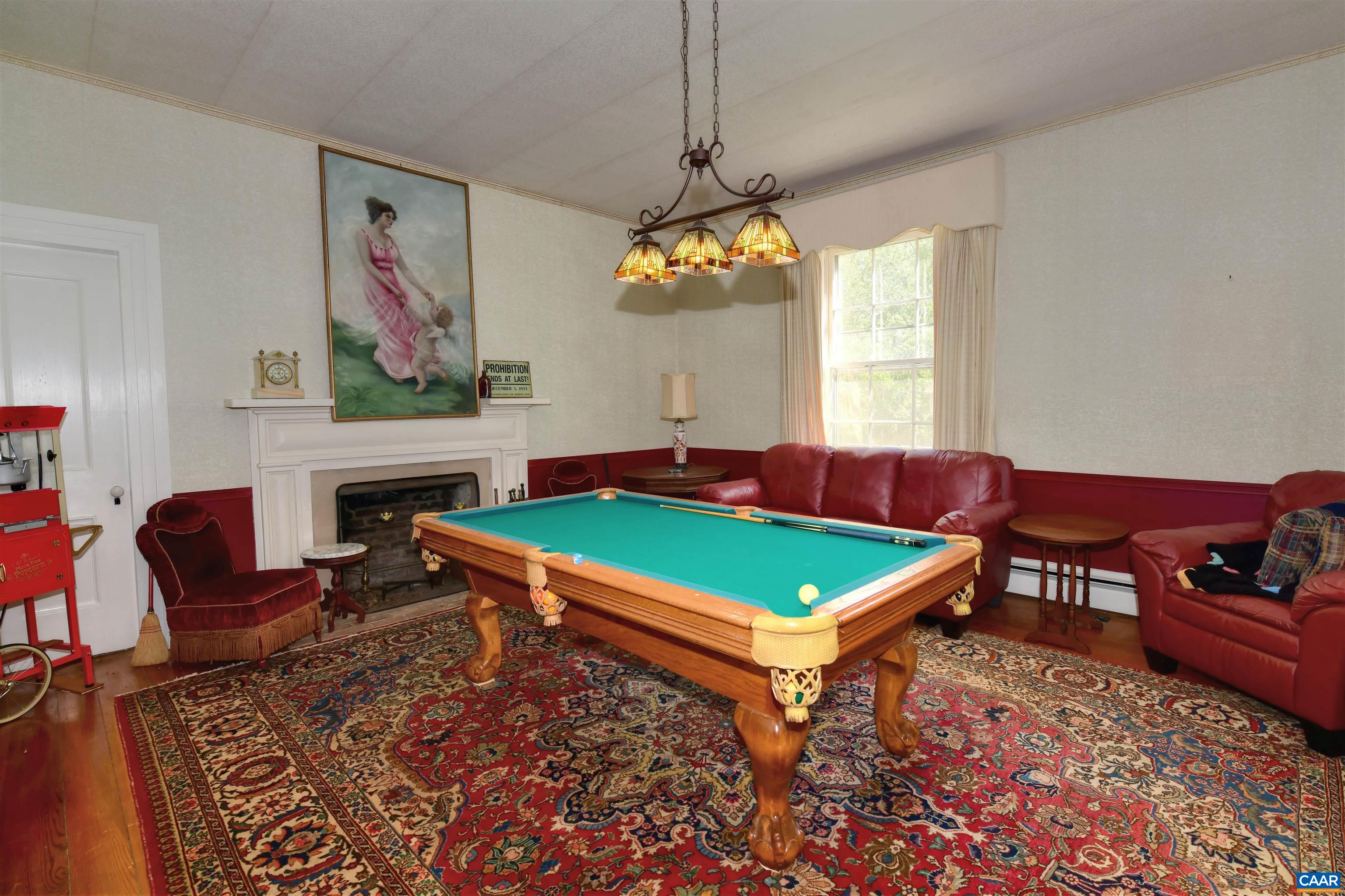 879 Evans Mill Road Dillwyn, VA 23936 - Photo 16 of 43 a room with pool table windows and wooden floor