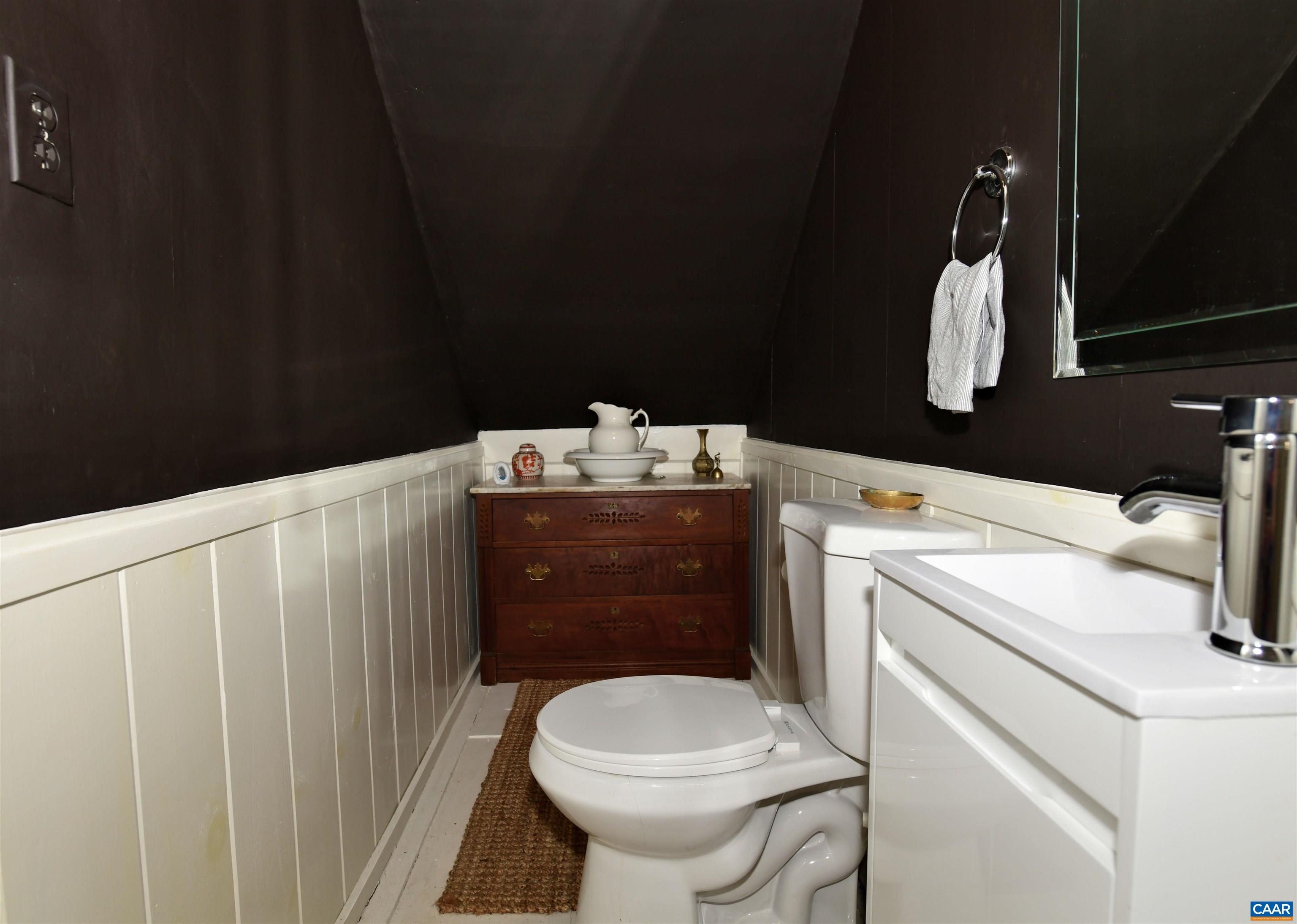 879 Evans Mill Road Dillwyn, VA 23936 - Photo 19 of 43 a bathroom with a sink toilet and mirror
