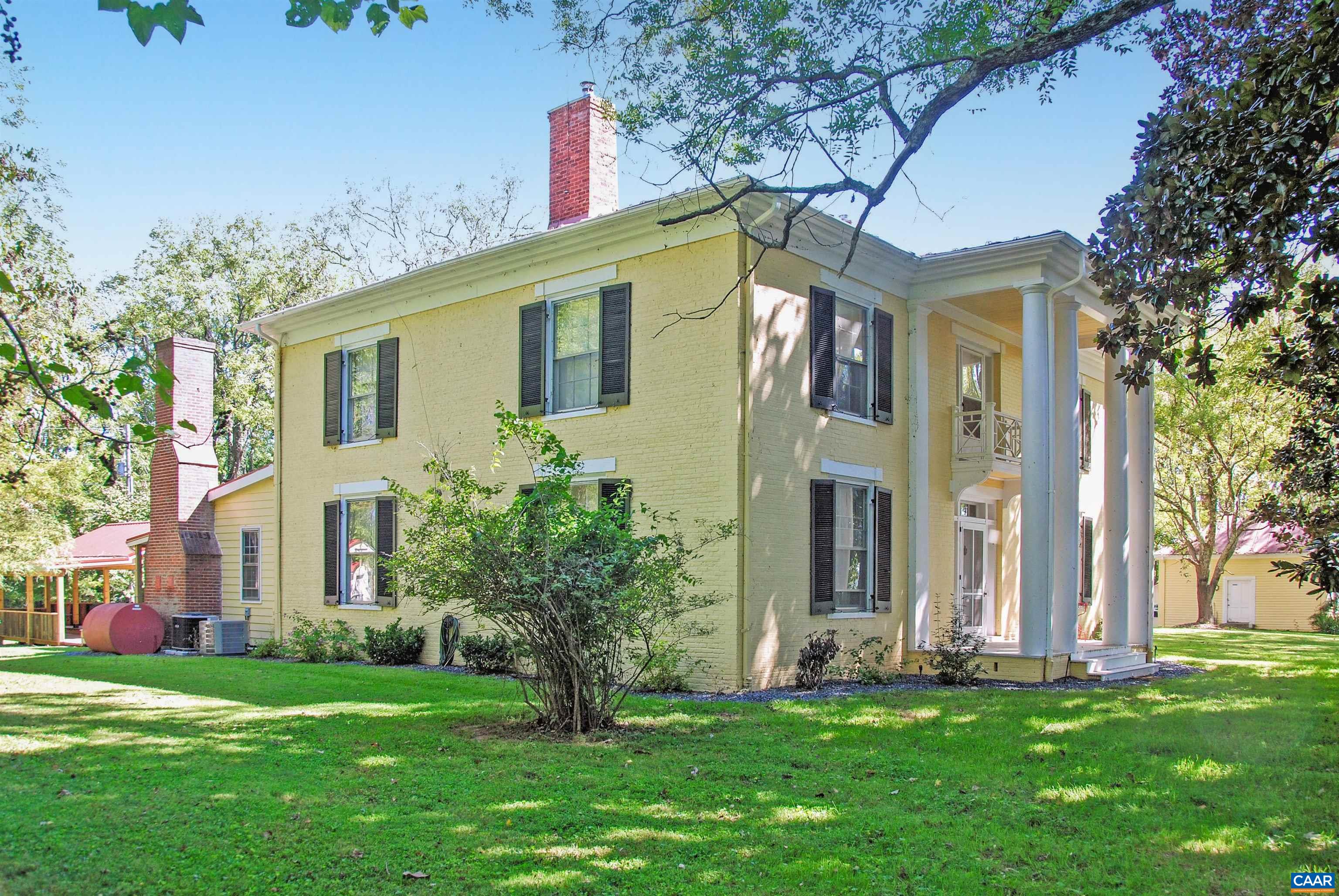 879 Evans Mill Road Dillwyn, VA 23936 - Photo 2 of 43 a front view of a house with a garden