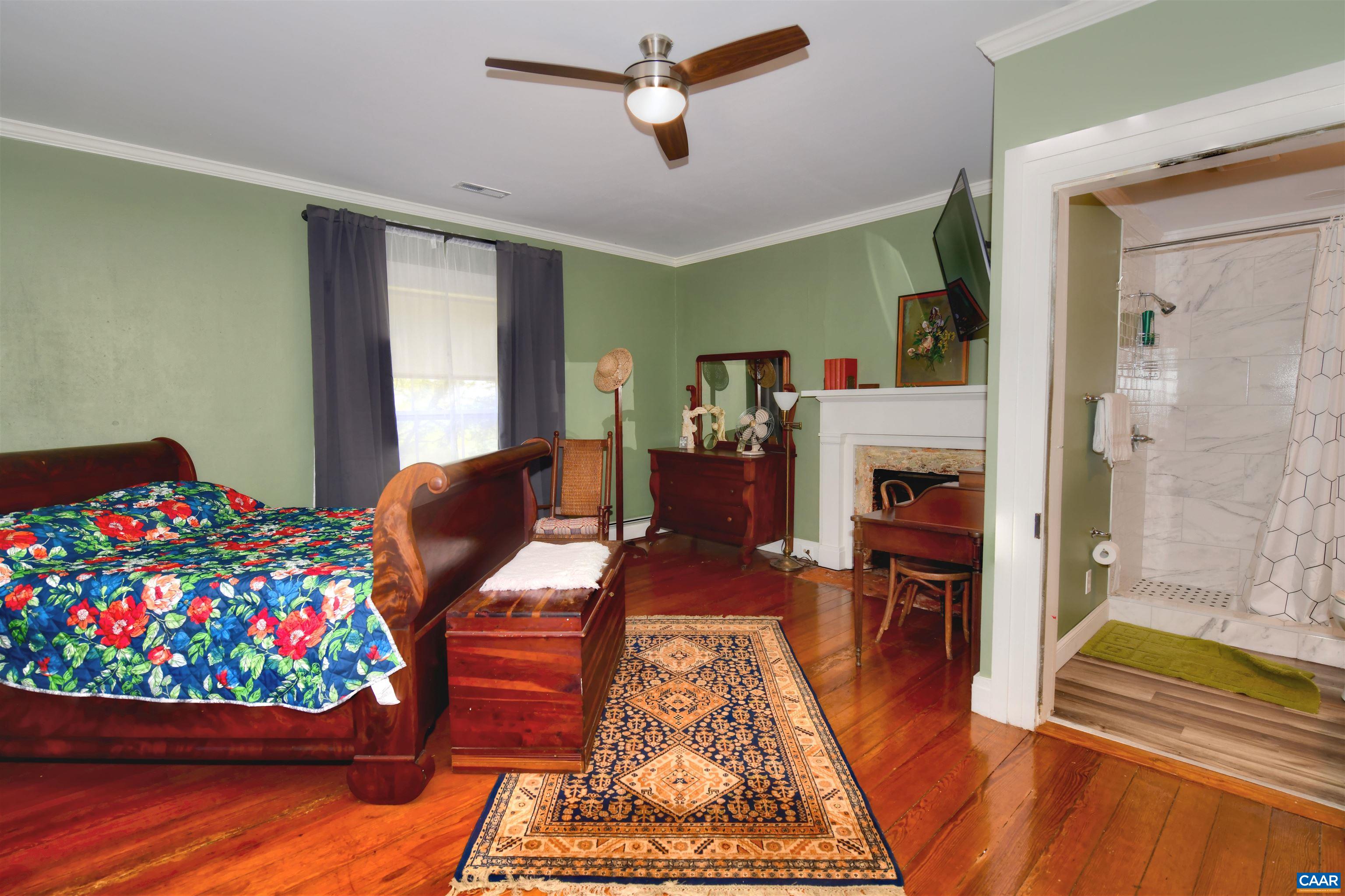 879 Evans Mill Road Dillwyn, VA 23936 - Photo 22 of 43 a living room with furniture and a floor to ceiling window