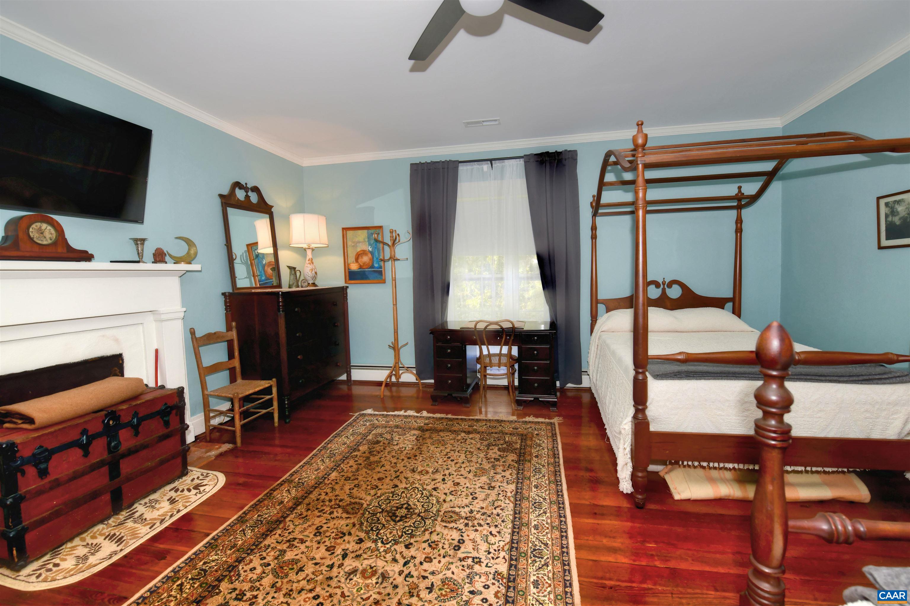 879 Evans Mill Road Dillwyn, VA 23936 - Photo 28 of 43 a living room with furniture and a flat screen tv