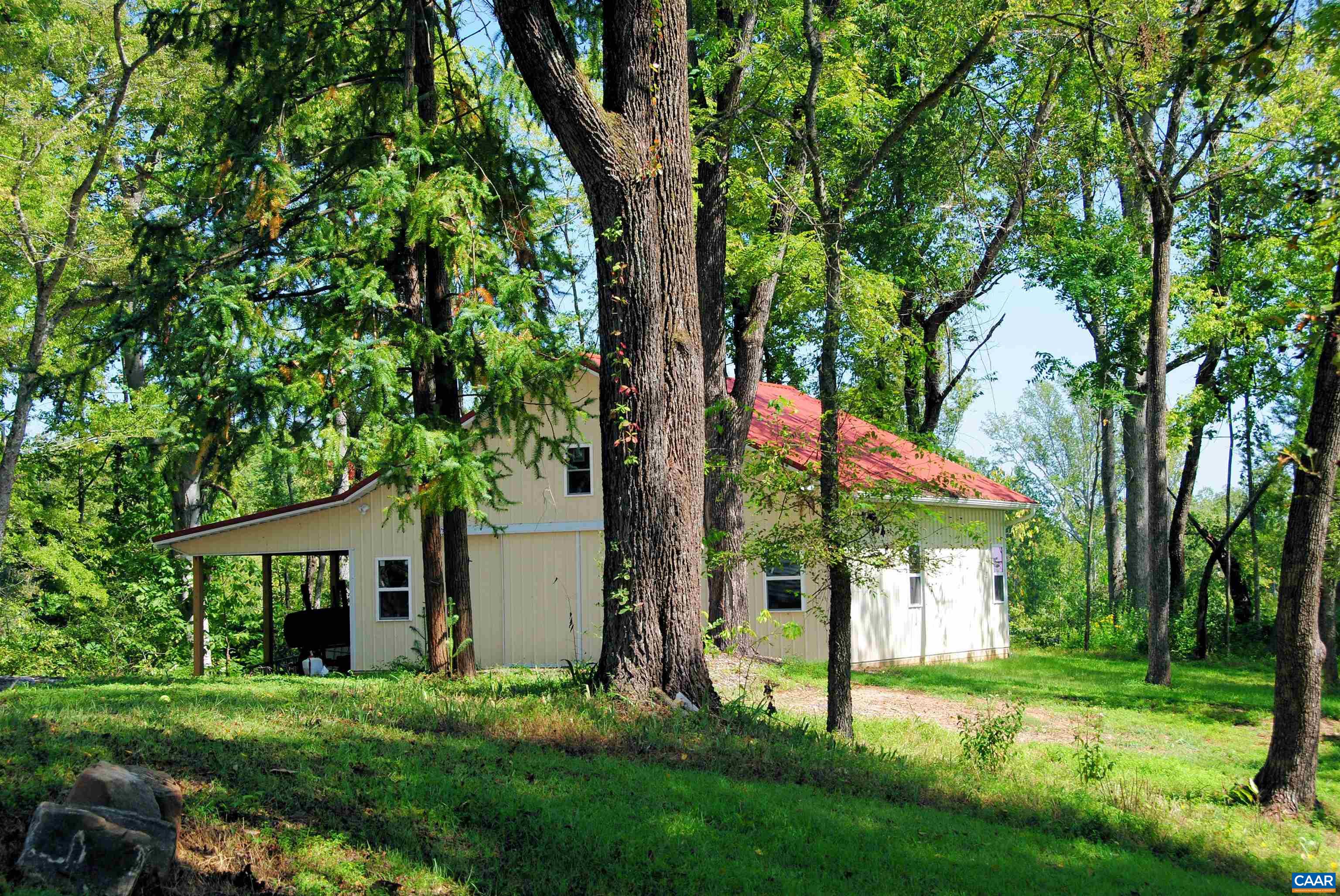 879 Evans Mill Road Dillwyn, VA 23936 - Photo 38 of 43 a view of a house with backyard and a tree