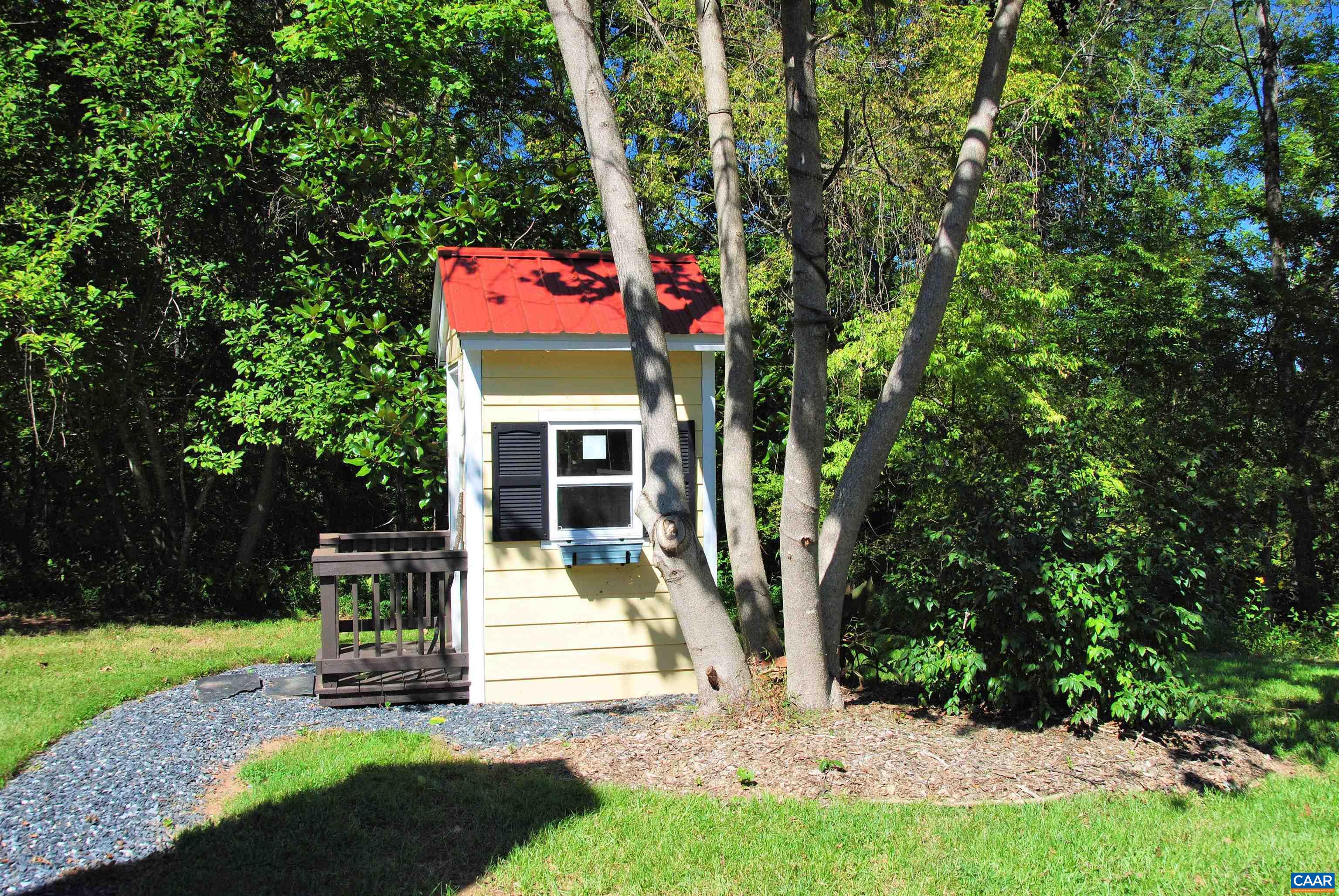 879 Evans Mill Road Dillwyn, VA 23936 - Photo 40 of 43 a front view of a house with a garden and tree