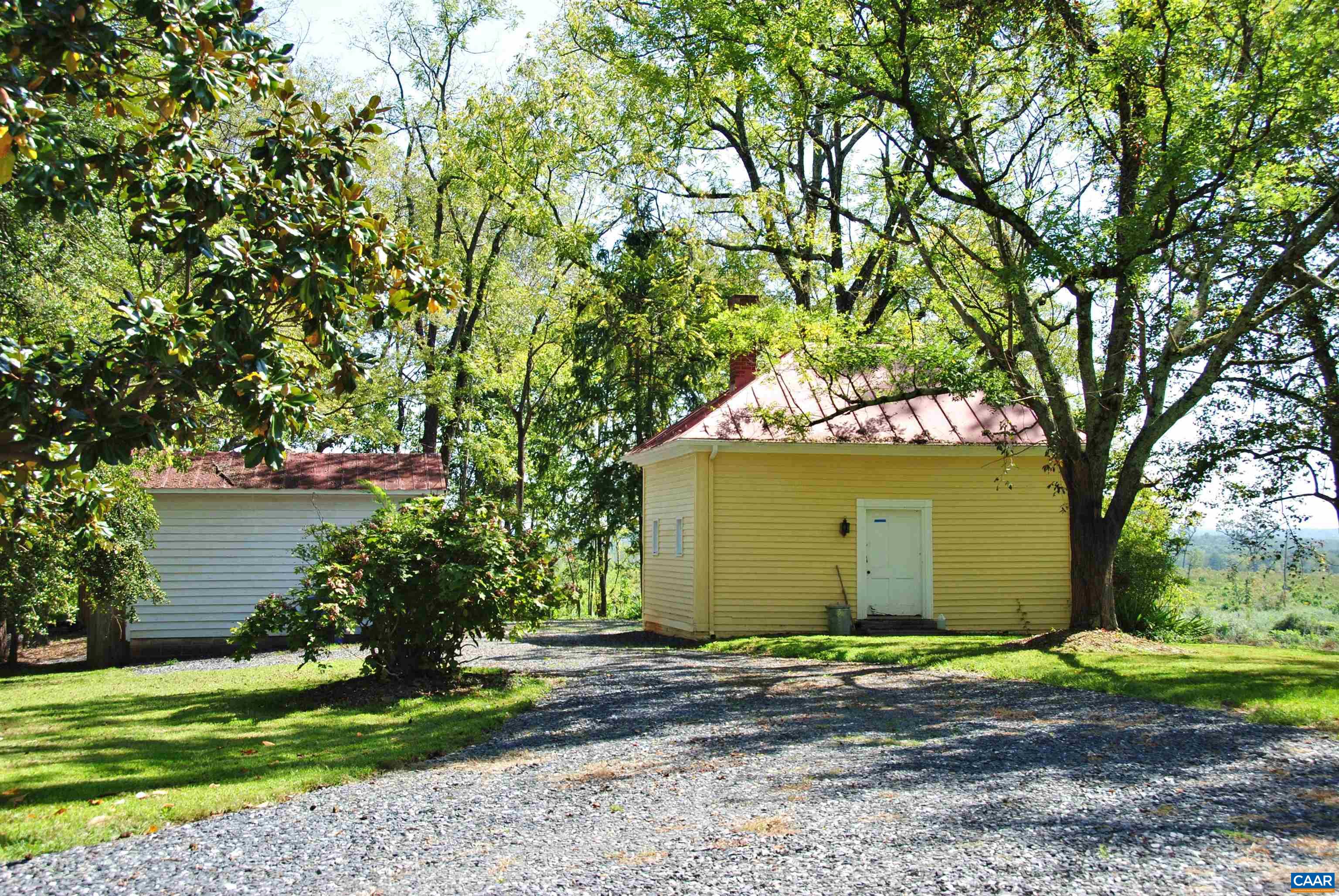 879 Evans Mill Road Dillwyn, VA 23936 - Photo 6 of 43 a front view of a house with garden
